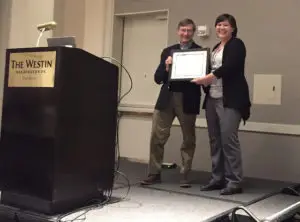 2017 FABBS Early Career Impact Award, Bethany Reeb - Sutherland, Florida International University receiving the  from ISDP President Nathan Fox.